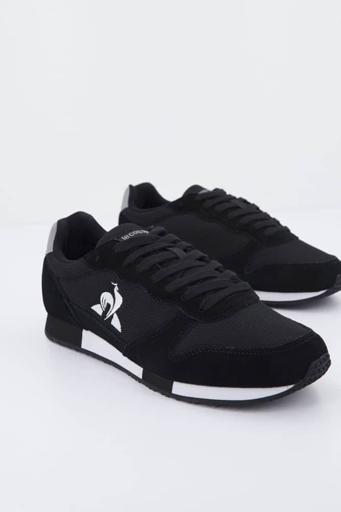 Baskets sport noires unisexes à semelle contrastée