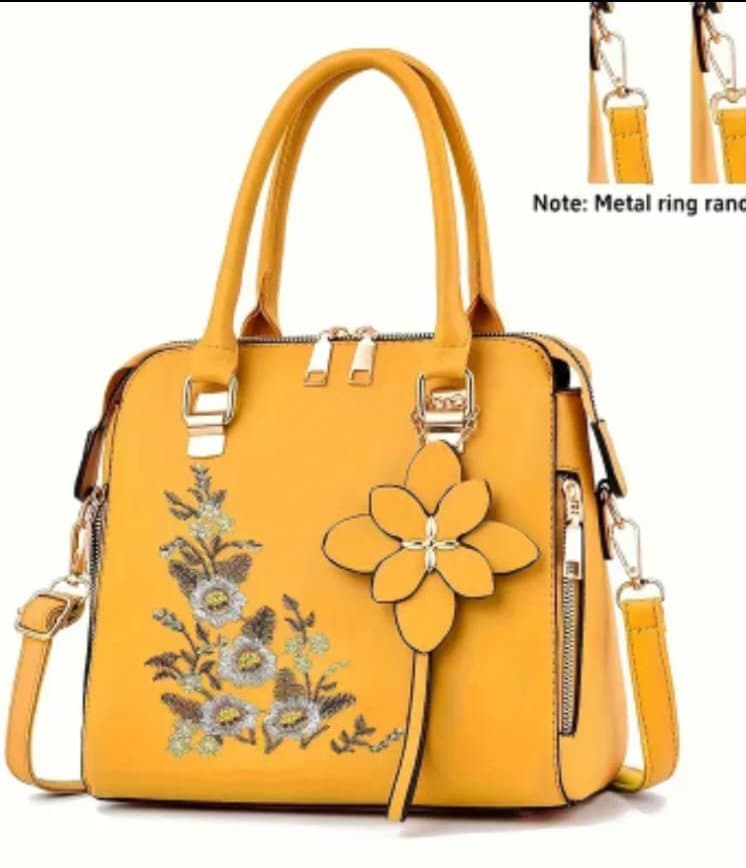 Sac à main vert à fleurs brodées
